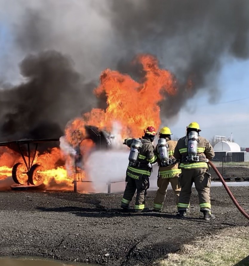 Airport Emergency Responders practicing fire fighting at training centre.